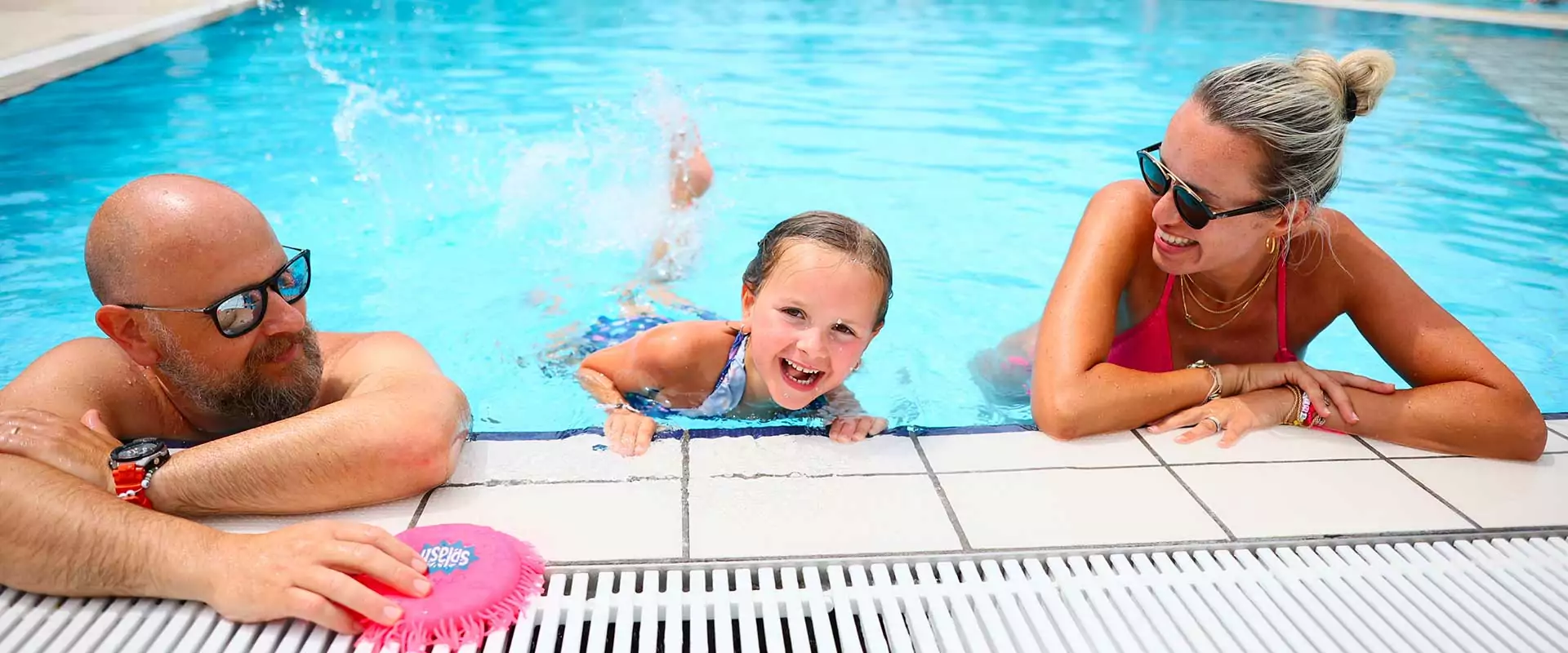 family in the pool at san francesco village